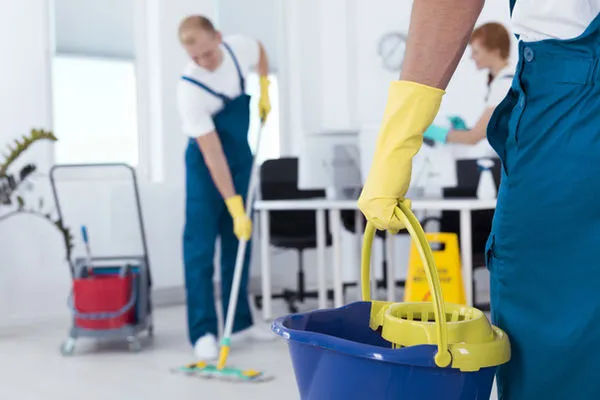 Cleaning professional mopping floors for premium janitorial service